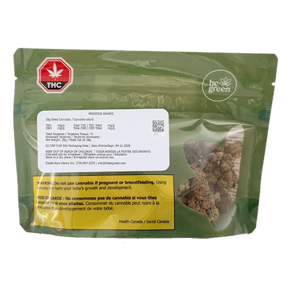 Front view of the green bc green Modified Grapes pouch with a clear window showing dried cannabis buds and warning labels.