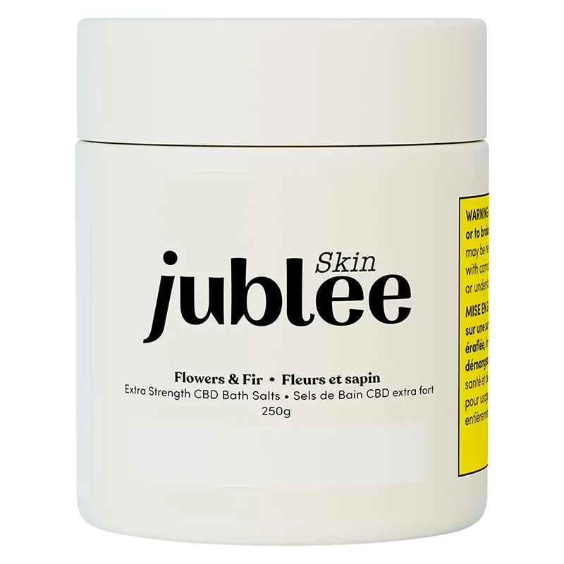 Front-facing shot of the white jar labeled "jublee Skin Flowers & Fir Extra Strength CBD Bath Salts" on a plain white background.