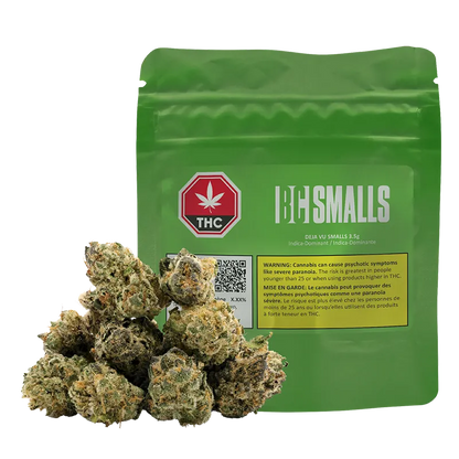 Front-facing shot of a green pouch labeled Deja Vu Smalls with a pile of frosty cannabis buds in front.
