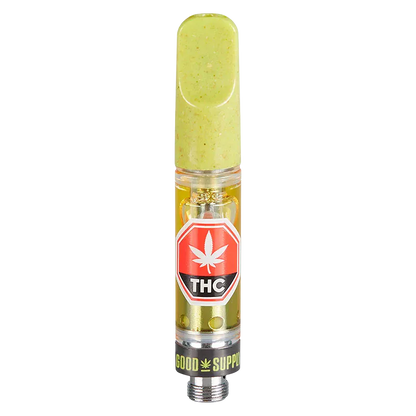 Centered vertical studio shot of a Blue Dream Vape Cartridge with a pale green mouthpiece, visible oil reservoir, and red THC label.