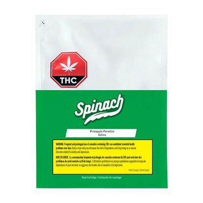 A close-up of the Spinach Pineapple Paradise Vape Cartridge featuring bold branding and a green cannabis leaf symbol against a white background.