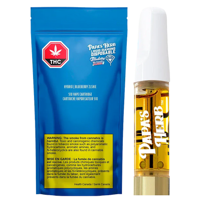 Front-facing product shot of the Blueberry Zlshie Vape Cartridge showing a blue resealable pouch beside a clear cartridge filled with golden oil.