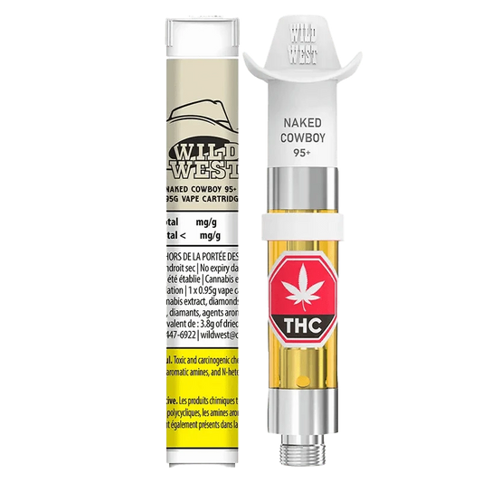 Close-up of the 95+ Naked Cowboy Liquid Diamonds Vape Cartridge with a bright, gold and white label against a black backdrop.