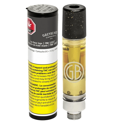 Close-up of the Pink Sunset Pure Live Resin Vape Cartridge with a metallic finish, angled against a dark, blurred background.