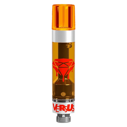 Straight-on studio shot of the Tropic OG Liquid Diamonds Vape Cartridge showing its amber tank with a dripping red diamond logo and orange mouthpiece.