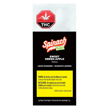 Front-facing pack shot showing the Spinach Sweet Green Apple Liquid Diamonds Vape Cartridge packaging with black background, red THC symbol and yellow warning panel.