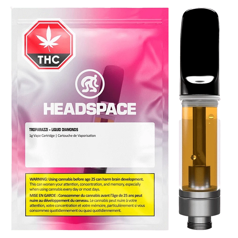 Front-facing image of a Troparazzi Liquid Diamond Vape Cartridge showing the amber-filled cartridge beside pink-gradient Headspace packaging.