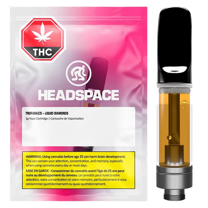 Front-facing image of a Troparazzi Liquid Diamond Vape Cartridge showing the amber-filled cartridge beside pink-gradient Headspace packaging.
