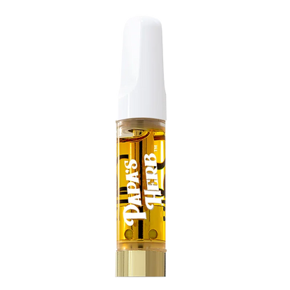 Center-frontal view of a filled cartridge labeled Papas Herb Blueberry Zlshie Liquid Diamond Vape Cartridge with a white mouthpiece and gold-toned liquid.