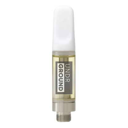 Center-aligned close-up of a clear cartridge filled with pale golden oil featuring the Violator Kush Cured Resin Vape Cartidge label and a white mouthpiece.