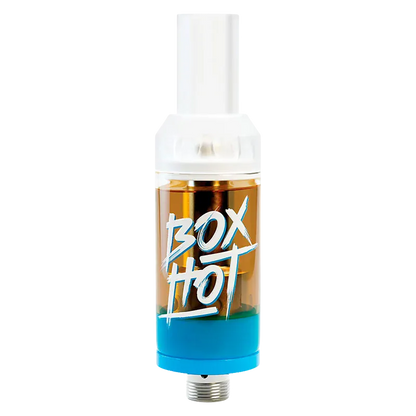 Centered product shot of a Code Blue Vape Cartridge showing a clear amber tank with white mouthpiece, blue base, and "BOX HOT" script on the body.