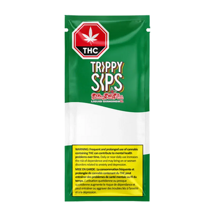 Front-facing shot of the green and white packaging labeled "Trippy Sips Holiday Fruit Punch Diamond Vape Cartridge" with a red THC stop-sign logo and yellow warning box.
