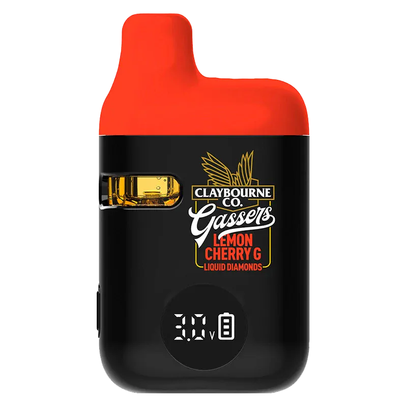 Front-facing view of the black and red Gassers Lemon Cherry G Liquid Diamonds Disposable Vape showing its side juice window, logo artwork, and digital 3.0V display