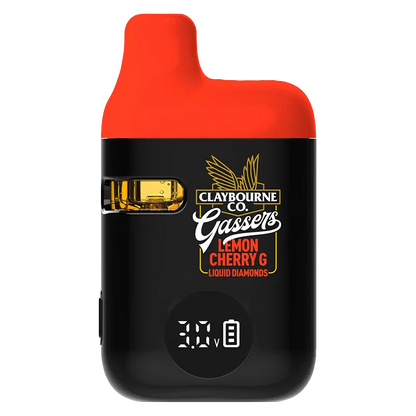Front-facing view of the black and red Gassers Lemon Cherry G Liquid Diamonds Disposable Vape showing its side juice window, logo artwork, and digital 3.0V display