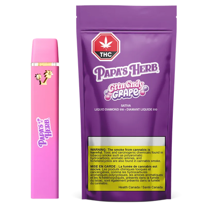 Front-facing shot of a pink CttnCndy Grape Liquid Diamond Disposable Vape placed beside its purple Papa's Herb CttnCndy Grape packaging.