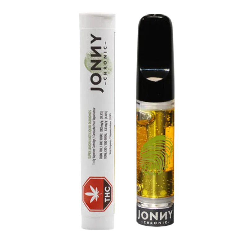 Front-facing shot of the Super Lemon Haze Liquid Diamonds Vape Cartridge showing a clear 1 g cartridge of golden oil with a black mouthpiece beside white Jonny Chronic branded packaging.
