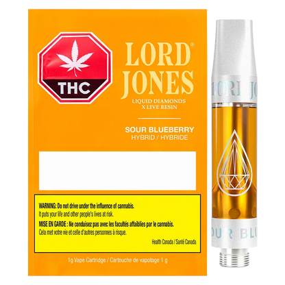 Right-side view of the Sour Blueberry Liquid Diamonds Vape Cartridge by Lord Jones showing the golden oil chamber and silver mouthpiece against its orange branded box.