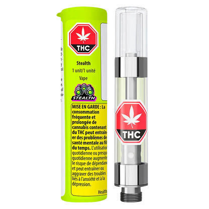 Front-facing shot of a clear cartridge next to neon green packaging labeled Stealth Vape Cartridge 1 g, both showing red THC stop-sign logos.