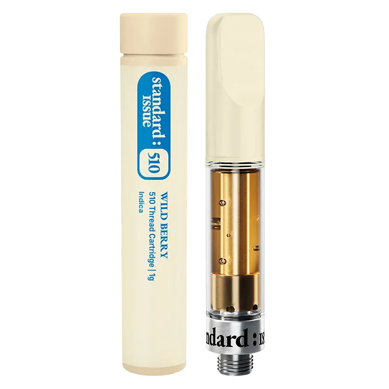 Close-up front view of the Wild Berry Vape Cartridge showing a clear glass cartridge with gold interior components beside its cream-colored 1 g tube.