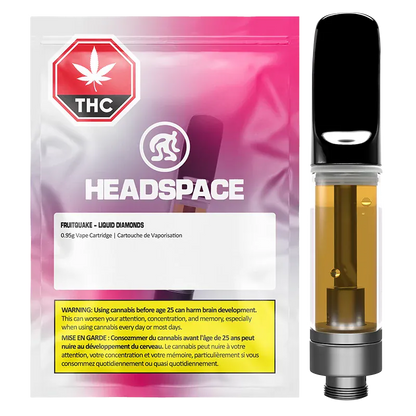 Front-facing product shot of the Headspace Fruitquake Liquid Diamond Vape Cartridge next to its pink-to-purple gradient, resealable pouch.
