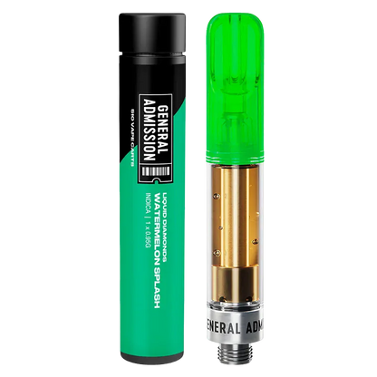 A studio-lit front view of the Watermelon Splash Liquid Diamond Vape Cartridge by General Admission standing next to its green-and-black cylindrical tube.