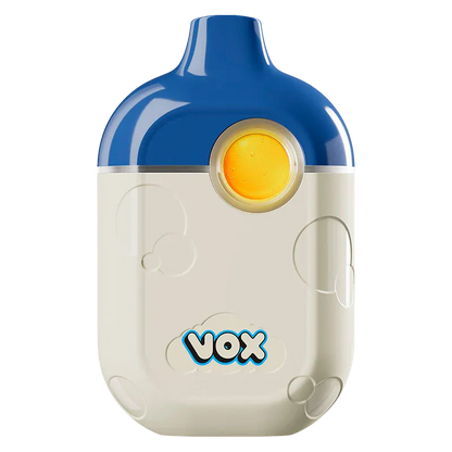 Front-facing shot of a two-tone Blue Raspberry Disposable Vape with a blue top, cream body, circular yellow mouthpiece, and "vox" logo near the base.