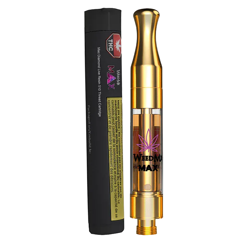Angled studio shot of the Mac Diamond Live Resin Vape Cartridge standing next to its black cylindrical packaging, the gold cartridge showing amber oil and a purple leaf logo.