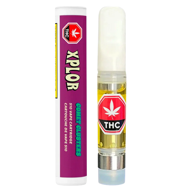 Straight-on product shot of a Comet Clusters Vape Cartridge showing the clear 510 cartridge of amber oil with a white mouthpiece next to its purple cylindrical packaging.