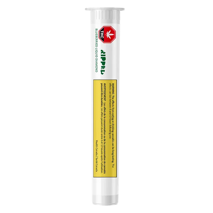 Tall, vertical studio shot of a white tube labeled Blueberried Liquid Diamond Vape Cartridge with a red THC symbol and yellow warning panel.