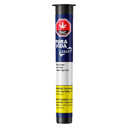 Studio-lit vertical view of the Blue Dream Jumbo Vape Cartridge showing its navy Pura Vida Legacy tube label and yellow warning band.