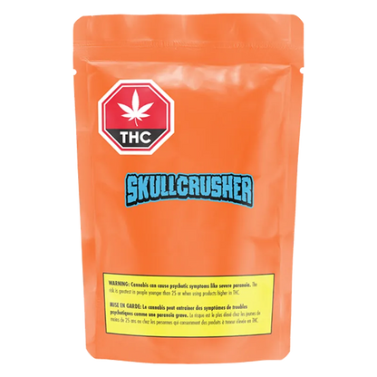 Front-facing shot of an orange pouch labeled Iced Orange Melted Diamond Vape Cartridge with a blue "SKULLCRUSHER" logo and a red THC emblem.