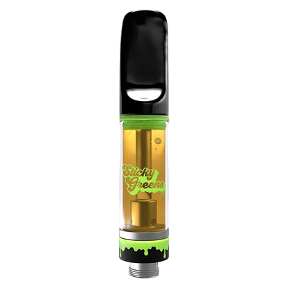Front-facing close-up of the Golden CRML Liquid Diamond Vape Cartridge showing a transparent gold-filled chamber, black mouthpiece, and green "Sticky Greens" accent.