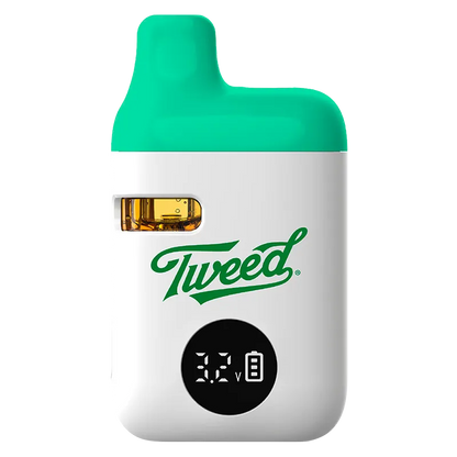 Front view of the Sour Green Apple Liquid Diamonds Disposable Vape by Tweed showing its white body, green mouthpiece, visible oil window and digital voltage display.