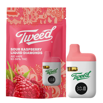 Front-facing shot of the Sour Raspberry Liquid Diamond Vape Cartridge by Tweed, with a white and pink pod beside its pink berry-patterned packaging.