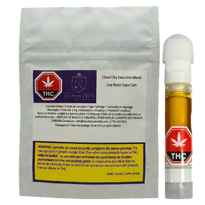 Front-facing photo of the 2026 Executive Blend Live Rosin Vape Cartridge and its silver foil pouch, the amber cartridge with a red THC label standing to the right.