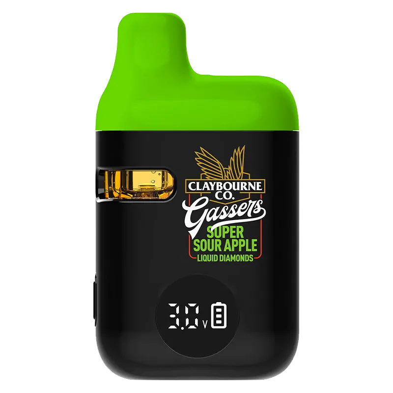 Front-facing close-up of the Gassers Super Sour Apple Liquid Diamonds Disposable Vape showing its black body, bright green mouthpiece, visible amber liquid window, and digital voltage display.