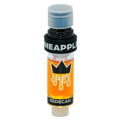 Centered upright against a white background, the Amped Live Resin Pineapple Express Vape Cartridge shows its clear glass chamber of amber oil, black crown logo, and bold "PINEAPPLE" band.