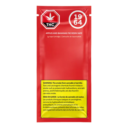 Front-facing red pouch packaging of Apples & Bananas Cured Resin Vape Cartridge with white logos and a yellow warning panel at the bottom
