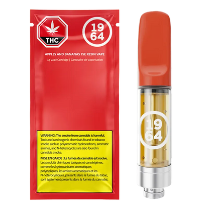 Product shot of a red Apples & Bananas Cured Resin Vape Cartridge package beside the cartridge with orange mouthpiece and clear oil chamber.