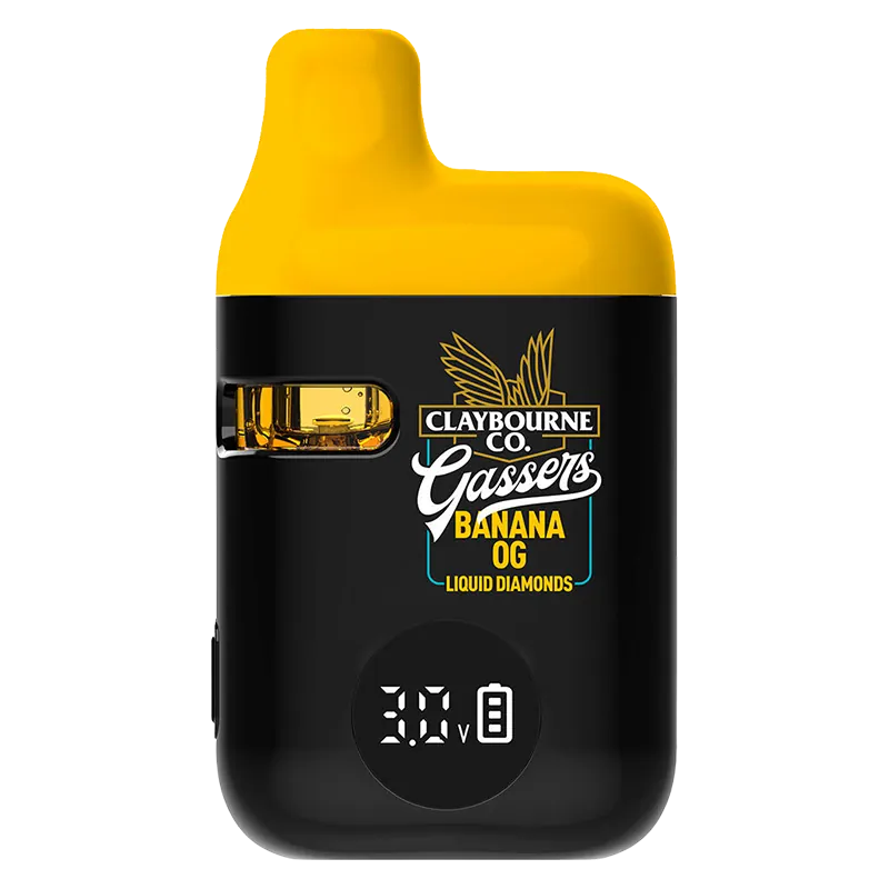 Front-facing shot of the Gassers Banana OG Liquid Diamonds Disposable Vape with a yellow top, black body, visible pod window and digital voltage readout.