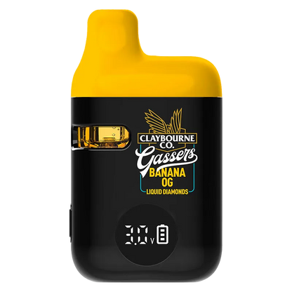 Front-facing shot of the Gassers Banana OG Liquid Diamonds Disposable Vape with a yellow top, black body, visible pod window and digital voltage readout.