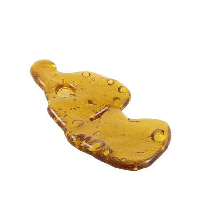 A close-up shot of the amber-colored 8 Ball Kush Shatter, displaying its translucent, glassy texture.