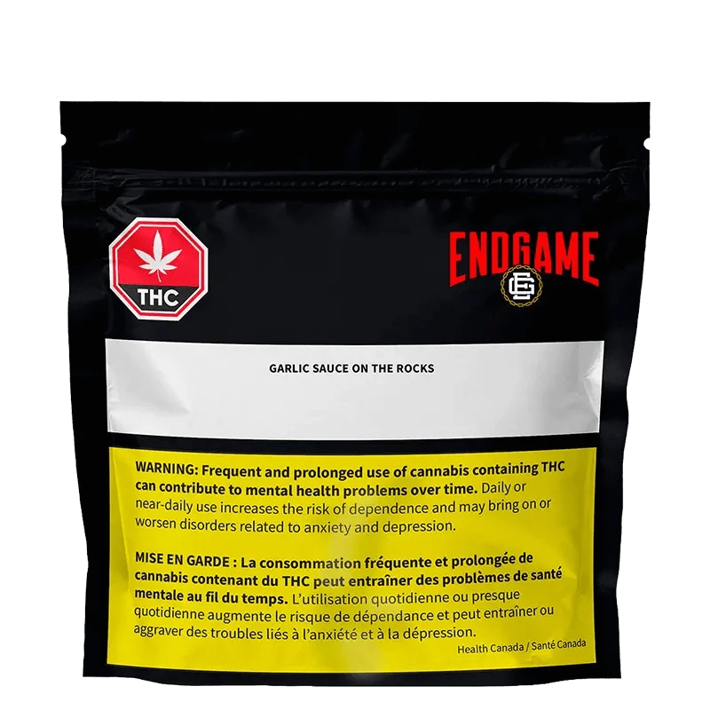 Front view of the “Garlic Sauce on the Rocks Diamonds and Terp Sauce” packaging against a black background with warning text.