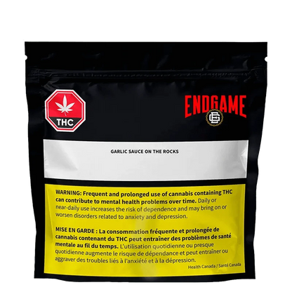 Front view of the “Garlic Sauce on the Rocks Diamonds and Terp Sauce” packaging against a black background with warning text.