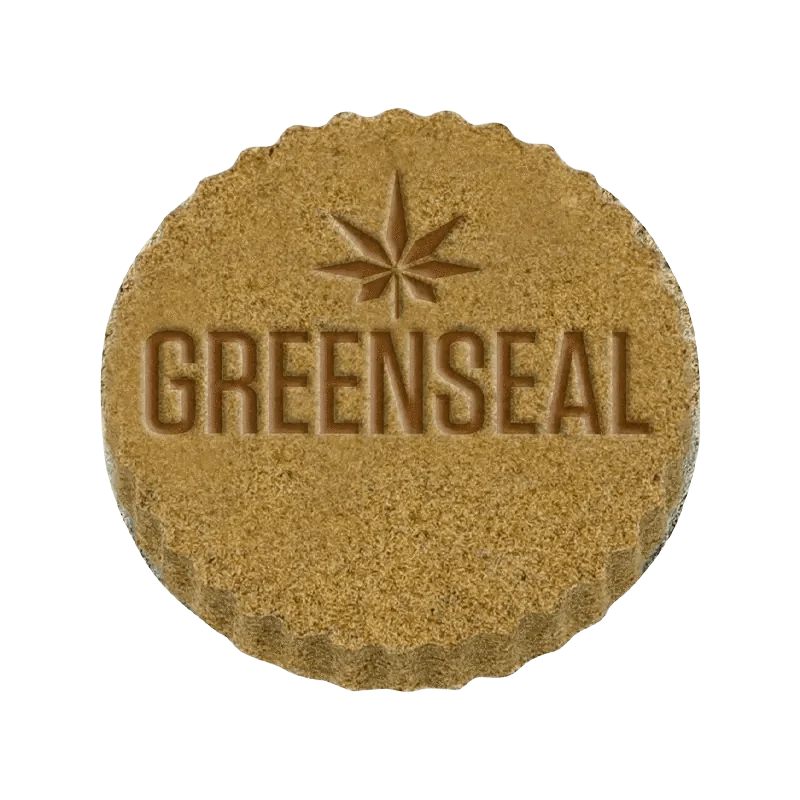 Close-up of Live Hash, displaying its textured surface and warm tones against a stark white background.