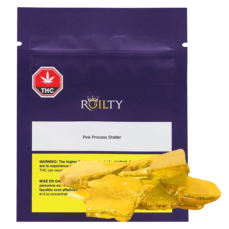 A close-up, top-down view of Pink Princess Kush Shatter, revealing a glassy, amber-colored substance within a clear container.