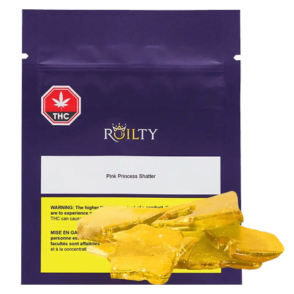 A close-up, top-down view of Pink Princess Kush Shatter, revealing a glassy, amber-colored substance within a clear container.