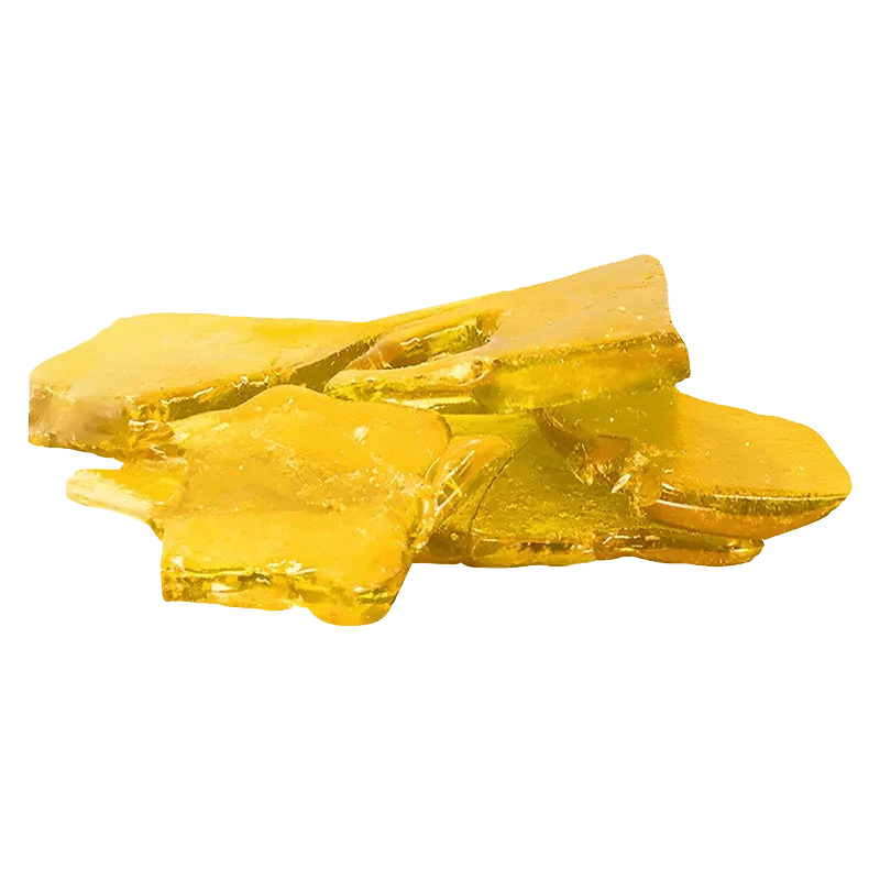 A close-up of the Pink Princess Kush Shatter, displaying a translucent amber fragment against a plain white background.