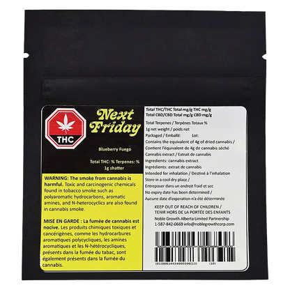Flat front view of the black package labeled Next Friday Blueberry Fuego Shatter with warning blocks and a white ingredient panel.