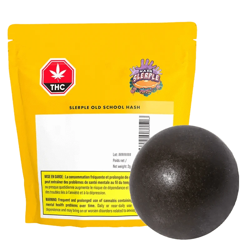A close-up of the Slerple Old School Hash, a dark, rectangular block with visible branding and French text on the packaging.